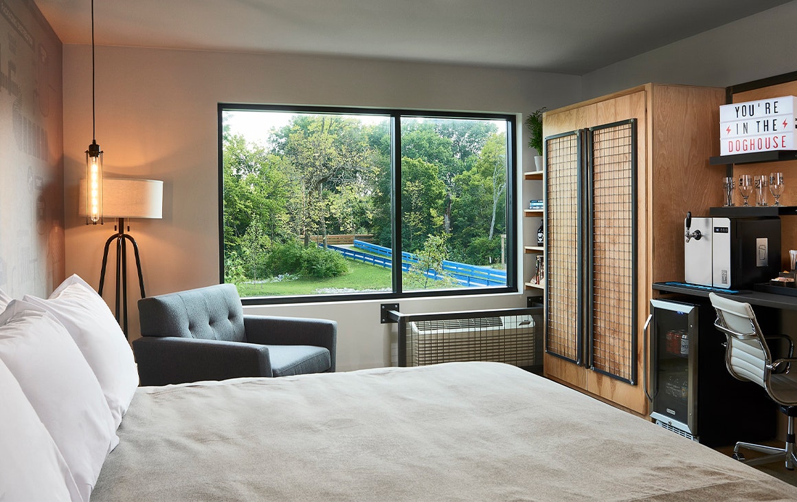 interior of a hotel room with a beer tap visible
